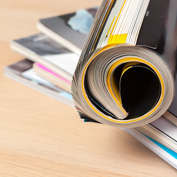 Close up of magazines rolled up